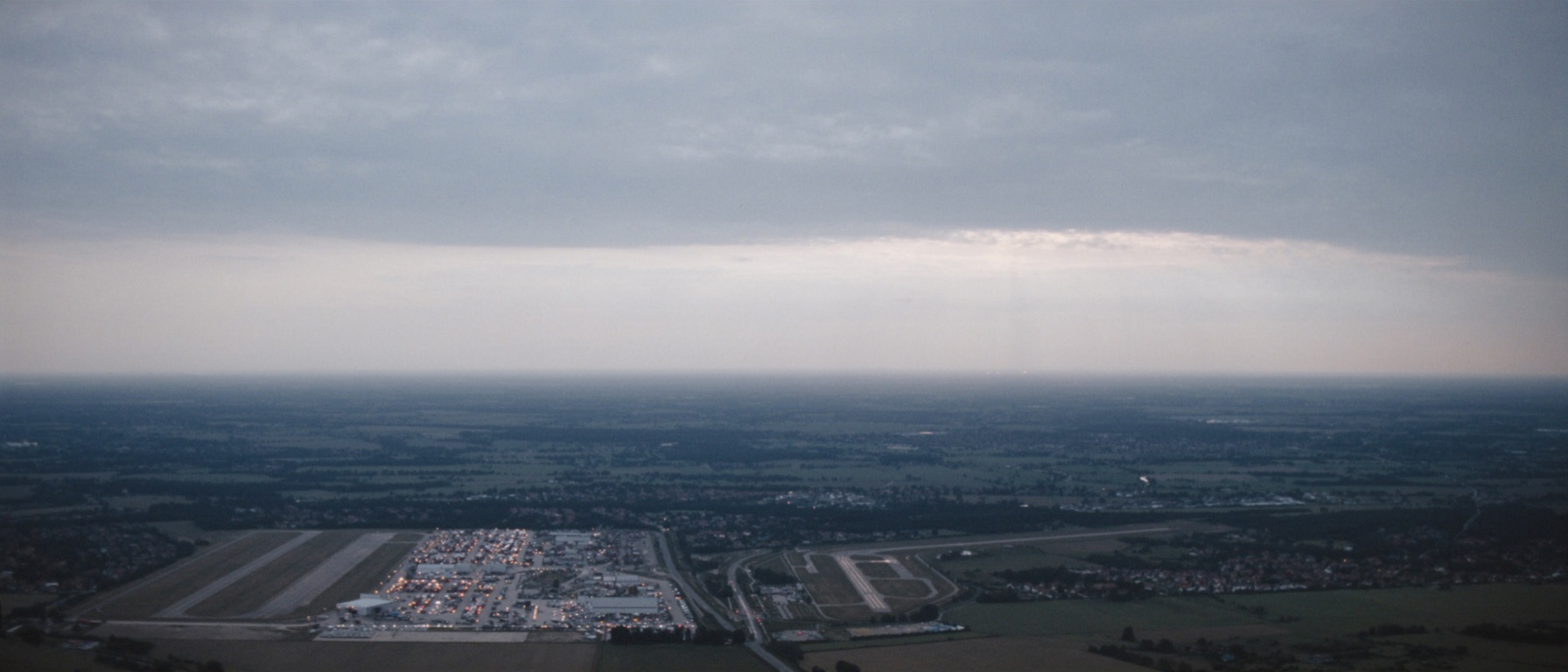 Aerial concept view of a regional airport with VAERN sensor masts on the perimeter